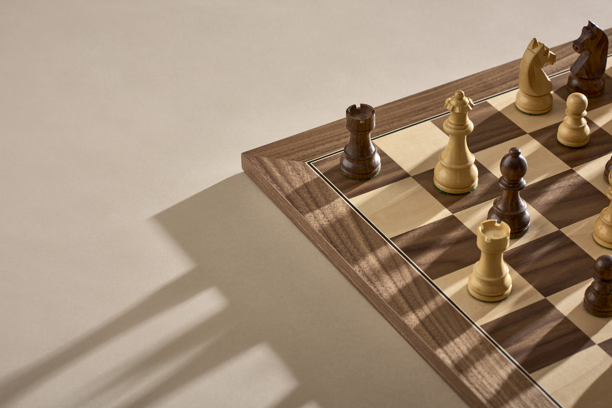 A chess board featuring a single wooden chess piece placed prominently on top.